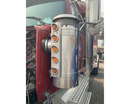 Driver side intake air cleaner from a 2002 Western Star 4964EX